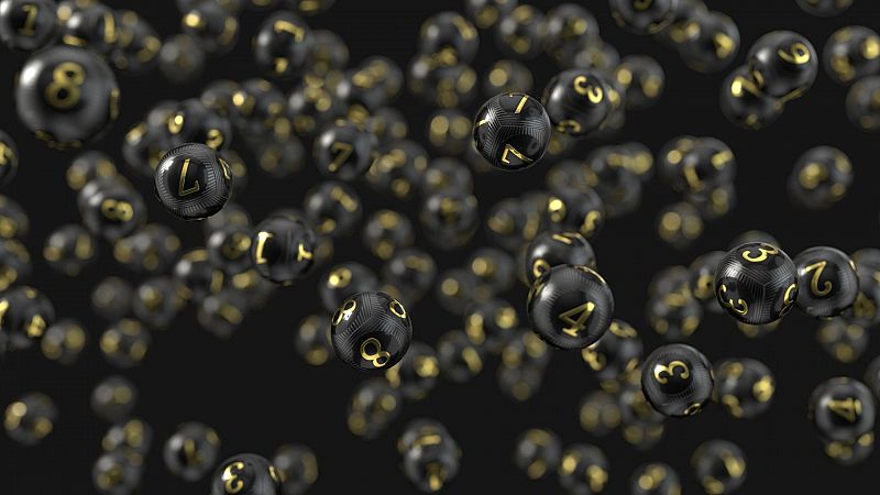 Lotería de Navidad: Una imagen negra con bolas de la lotería que tienen los números grabados en dorado
