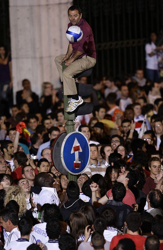 Real Madrid supporters celebrate at Cibeles fountain in central Madrid