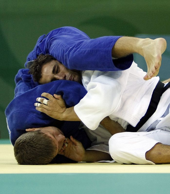 Mehmeddovic of Canada fights with Ibanez of Ecuador during their men's -66 kg preliminary judo match at the Beijing 2008 Olympic Games