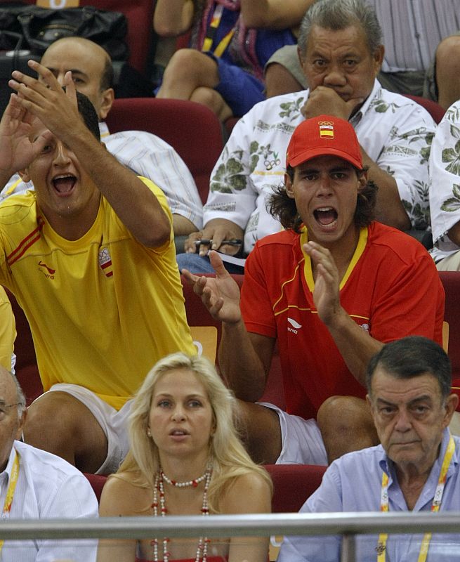 Spanish tennis player Nadal reacts while watching men's basketball game between Spain and Greece at Beijing 2008 Olympic Games