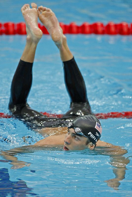 Michael Phelps of the U.S. looks down the pool after his men's 200m butterfly swimming semifinal during the Beijing 2008 Olympic Games