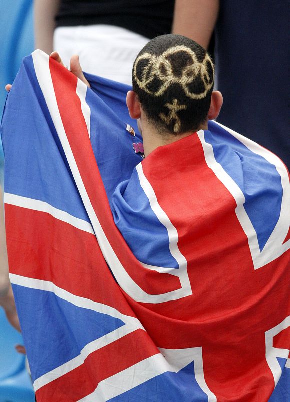 A man is pictured with an Olympics themed haircut at the swimming events at the National Aquatics Center during the 2008 Beijing Olympics