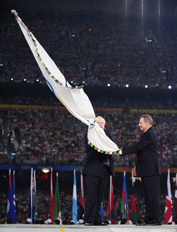 Mayor of London Boris Johnson receives the Olympic flag from IOC President Jacques Rogge during the closing ceremony of the Beijing 2008 Olympic Games at the National Stadium