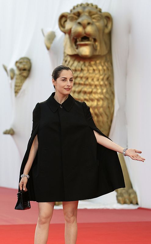 French actress Amira Casar poses for photographers on the red carpet at Venice Film Festival