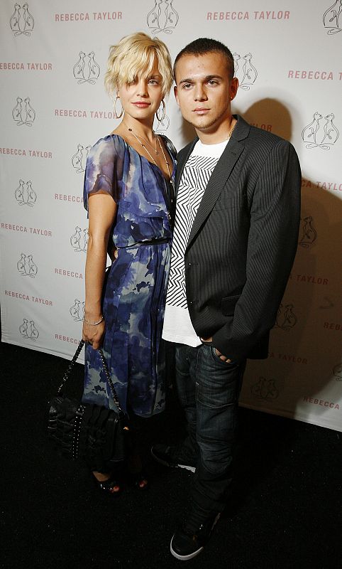 Actress Mena Suvari poses backstage with Simone Sestito before the Rebecca Taylor Spring 2009 show during Fashion Week in New York