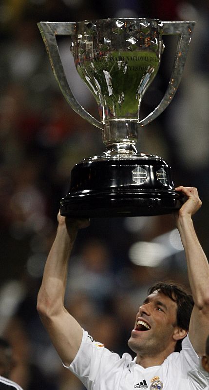 Real Madrid's Van Nistelrooy celebrates with Spanish First Division league trophy after victory over Levante in Madrid