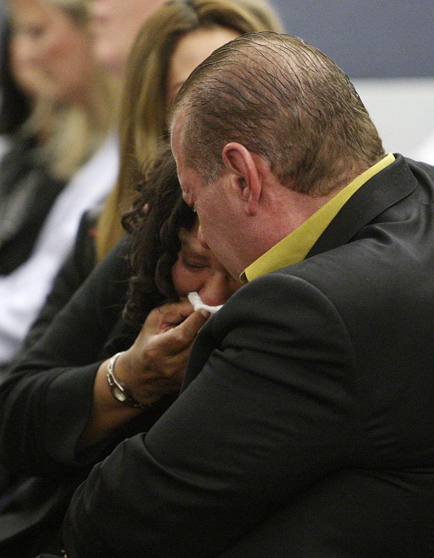 Simpson's sister Durio cries on the shoulder of Scotto as a verdict of guilty on all counts is read following Simpson's trial in Las Vegas