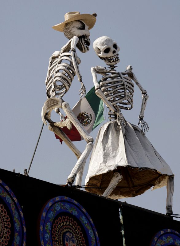 Skeleton installations are seen in a theatre where artists assembled an altar for the Dead in Mexico City's Zocalo main square