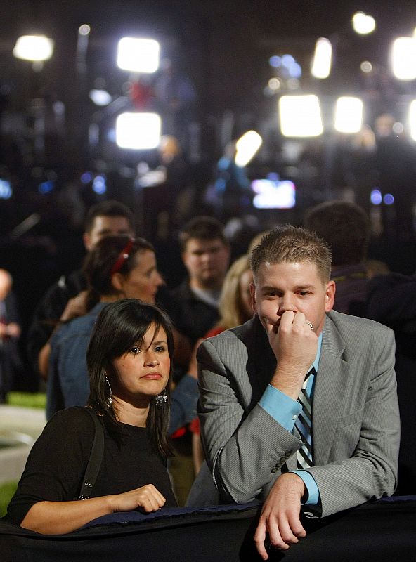 Guests react after U.S Republican presidential nominee Senator John McCain's concession speech in Phoenix