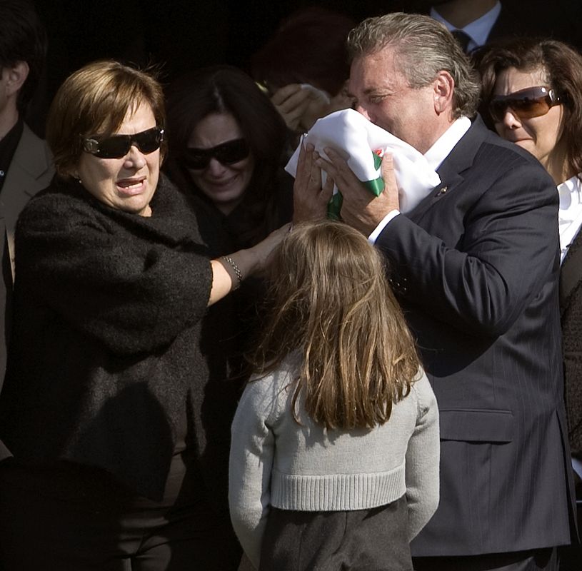 Carlos Murino, father of Mexico's Interior Minister Juan Camilo Mourino, cries during a ceremony in Mexico City