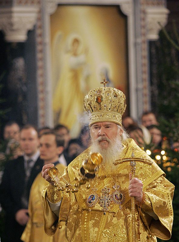 A file photo shows Russian Orthodox Patriarch Alexiy II burning incense during a Christmas mass in the Christ the Saviour cathedral in Moscow