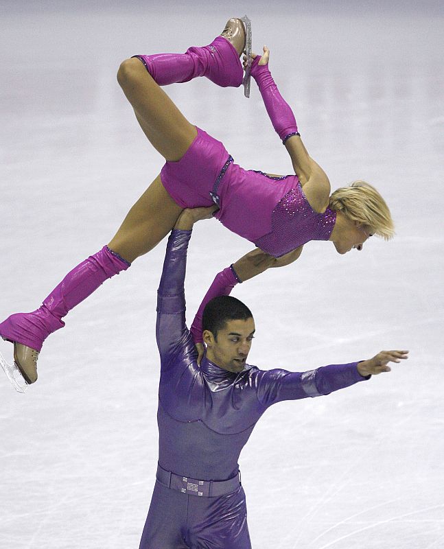 Savchenko and Szolkowy of Germany compete during the pair short program at the ISU Grand Prix of Figure Skating Final in Goyang