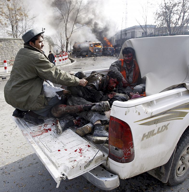 Victims of a blast at the German embassy are driven to a hospital in the back of a truck in Kabul