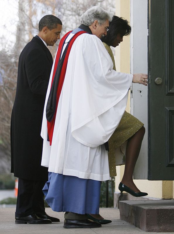 President elect Barack Obama Michelle Obama and Rev. Luis Leon walk into St. John's Church in Washington