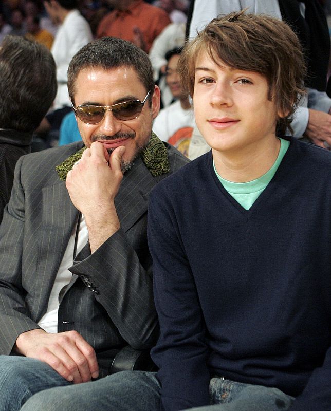 Actor Downey Jr. sits court side with his 14-year-old son Indio as they watch the Los Angeles Lakers take on Utah Jazz in their NBA basketball playoff game in Los Angeles