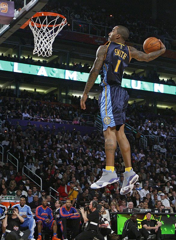 Denver Nuggets' J.R. Smith competes in the Slam Dunk contest at NBA All-Star weekend in Phoenix, Arizona