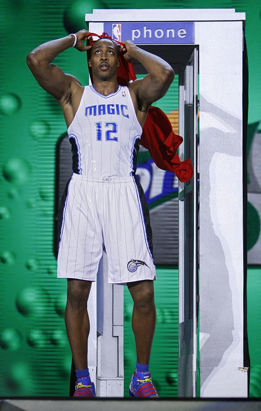 Orlando Magic's Dwight Howard puts on a Superman cape as he competes in the Slam Dunk contest at NBA All-Star weekend in Phoenix