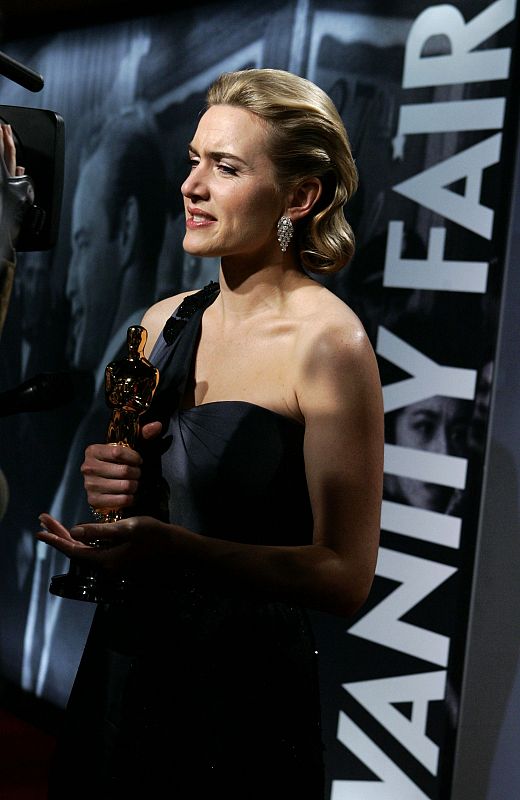 Actress Kate Winslet holds her Oscar for best actress for her work in "The Reader," as she poses during her arrival at the 2009 Vanity Fair Oscar Party in West Hollywood