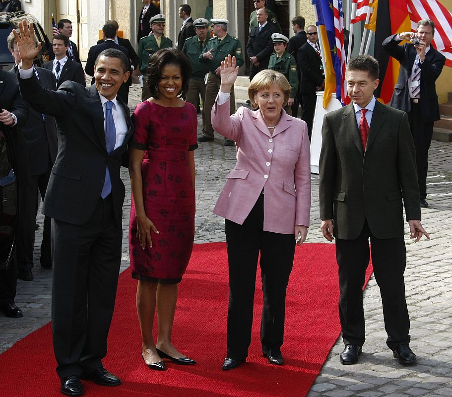 U.S. President Obama, first lady Michelle Obama, German Chancellor Merkel and her husband Sauer pose at a market place near the town hall in Baden-Baden