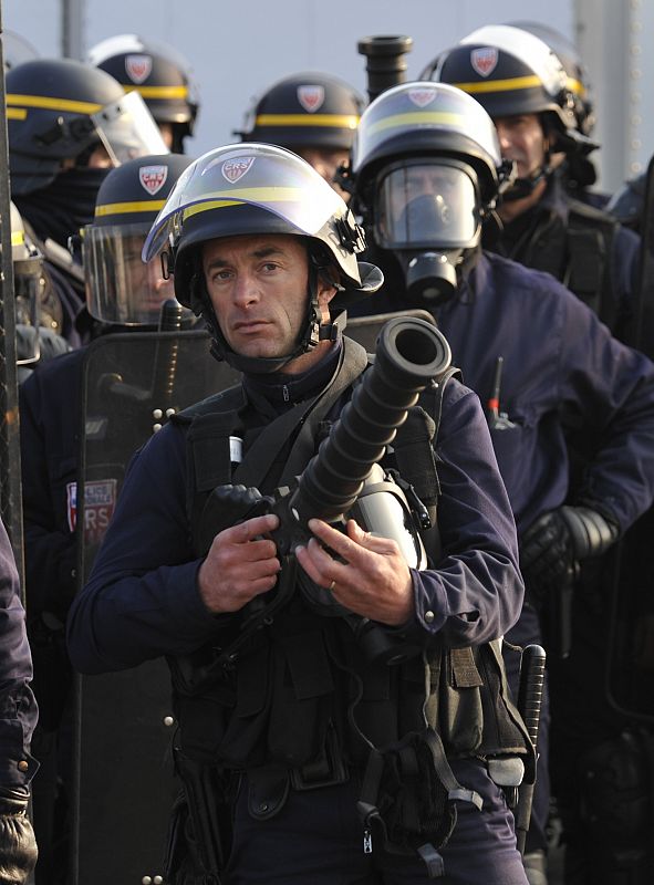 French riot police with tear gas launchers shields and batons to stop anti-NATO protestersare pictured in Strasbourg