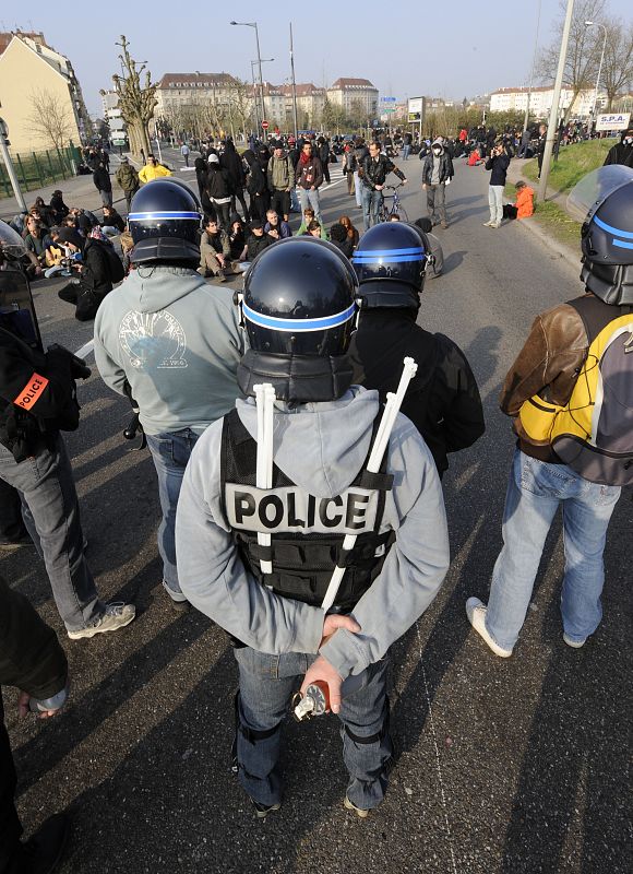 French plain clothed police line up to stop anti-NATO protesters in Strasbourg