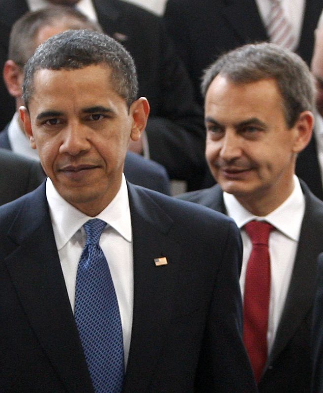 U.S. President Obama and Spain's PM Jose Luis Rodriguez Zapatero leave a group photo session at the E.U. Summit in Prague