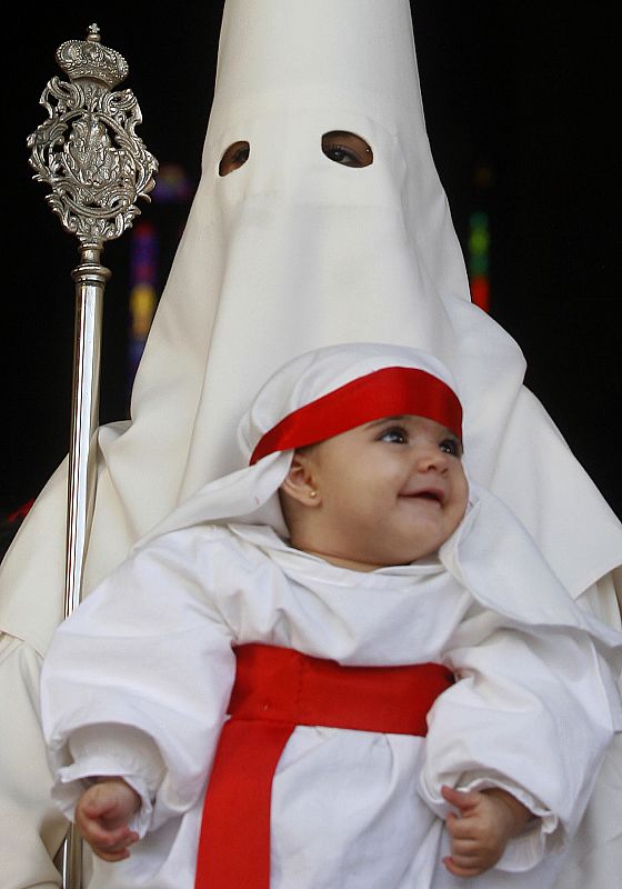 Penitents attend Palm Sunday procession during start of Holy Week in Cordoba