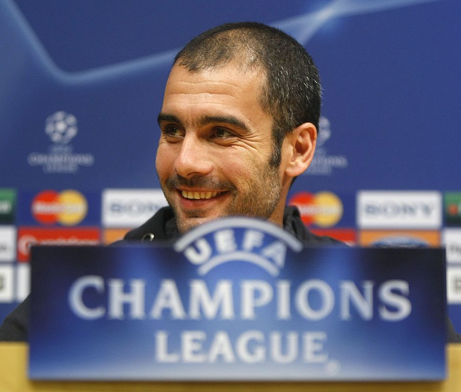 Barcelona's coach Pep Guardiola attends a news conference at Camp Nou stadium in Barcelona