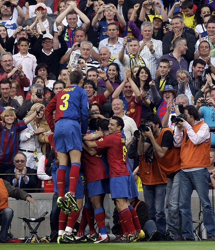 Barcelona's players celebrate their goal against Villarreal during their Spanish First Division soccer match in Barcelona.