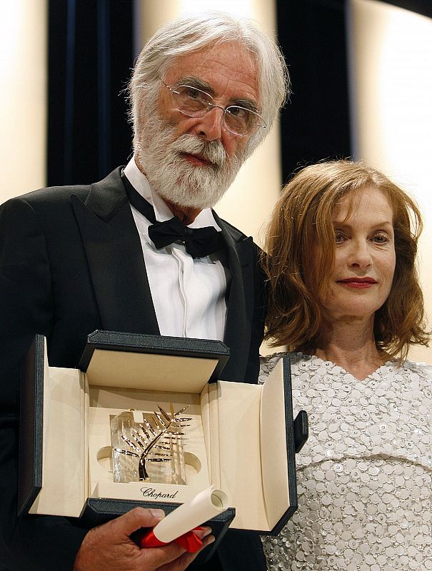 Director Haneke poses beside Jury President Huppert after receiving Palme d'Or award at 62nd Cannes Film Festival