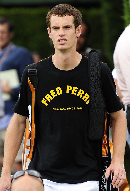 Britain's Murray arrives for training at Wimbledon in London