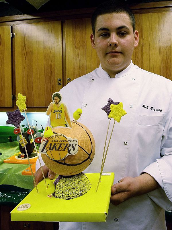Catalan pastry maker Escriba poses with a chocolate sculpture at Escriba Pastry Shop in Barcelona