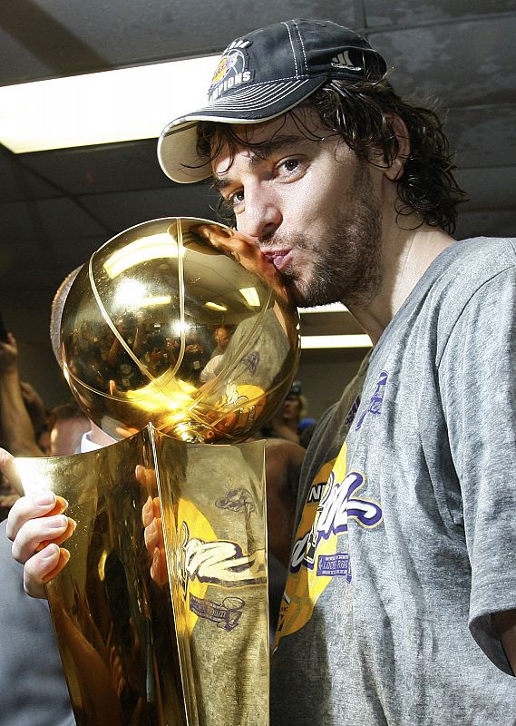 Los Angeles Lakers Pau Gasol kisses the Larry O'Brien Trophy after they defeated the Orlando Magic to win the NBA basketball championship in Orlando