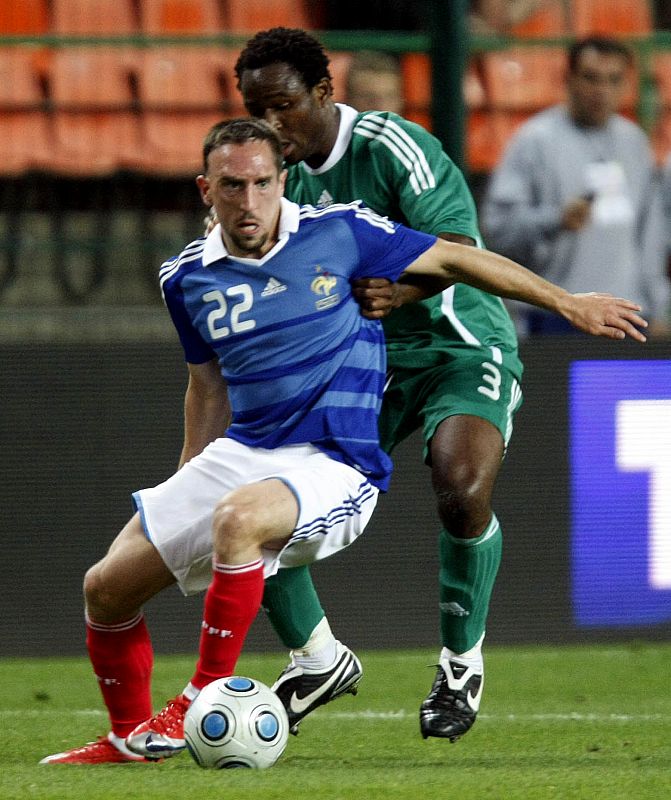 France's Ribery challenges Adefemi of Nigeria during their friendly soccer match at the Geoffroy Guichard stadium