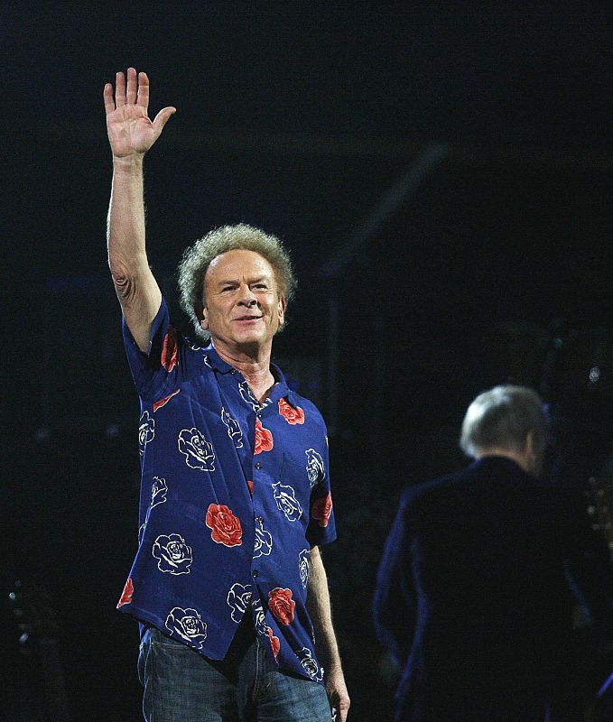 Art Garfunkel waves after performing during one of two 25th Anniversary Rock & Roll Hall of Fame concerts in New York