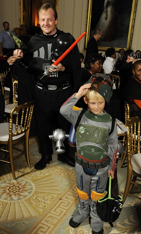 White House Press Secretary Gibbs and his son Ethan dress as Star Wars characters during a reception for Halloween at the White House in Washington