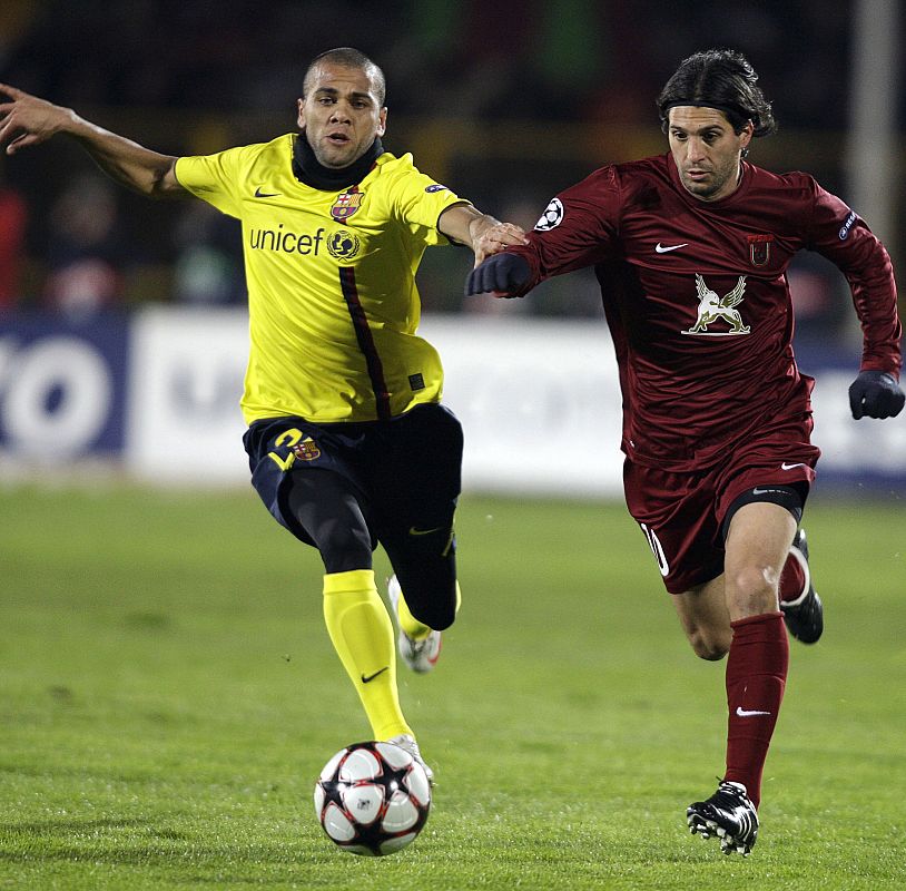 Barcelona's Alves challenges Rubin Kazan's Dominguez during their Champions League soccer match at the Central stadium in Kazan