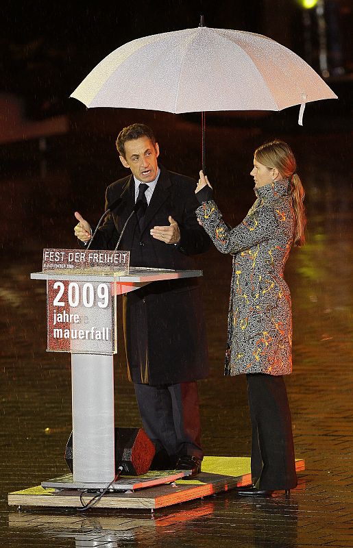 French President Sarkozy speaks at the Brandenburg Gate in Berlin during celebrations to mark the 20th anniversary of the fall of the Berlin Wall