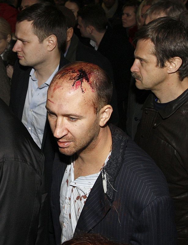 A man injured in a train crash arrives at Moskovsky train station in St. Petersburg