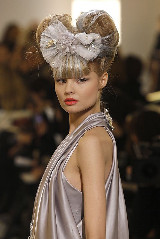 A model presents a creation by German designer Karl Lagerfeld as part of his Haute-Couture Spring Summer 2010 fashion show for French fashion house Chanel in Paris