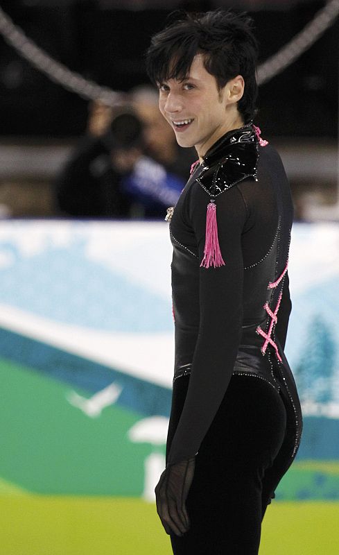 Weir of the U.S. smiles after his routine in the men's figure skating short programme at the Vancouver 2010 Winter Olympics