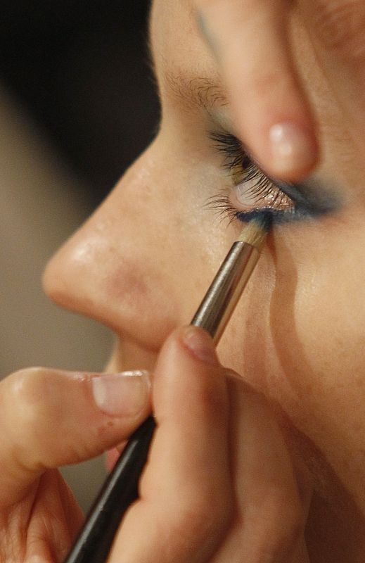 A model gets her make up done as she prepares for show of Spanish designer Francis Montesinos during Cibeles Madrid Fashion Week Fall/Winter 2010 show in Madrid