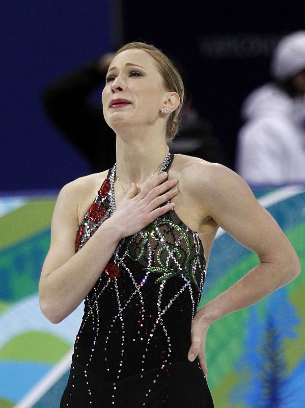 Canada's Rochette cries after finishing her routine in women's short programme figure skating event at Vancouver 2010 Winter Olympics