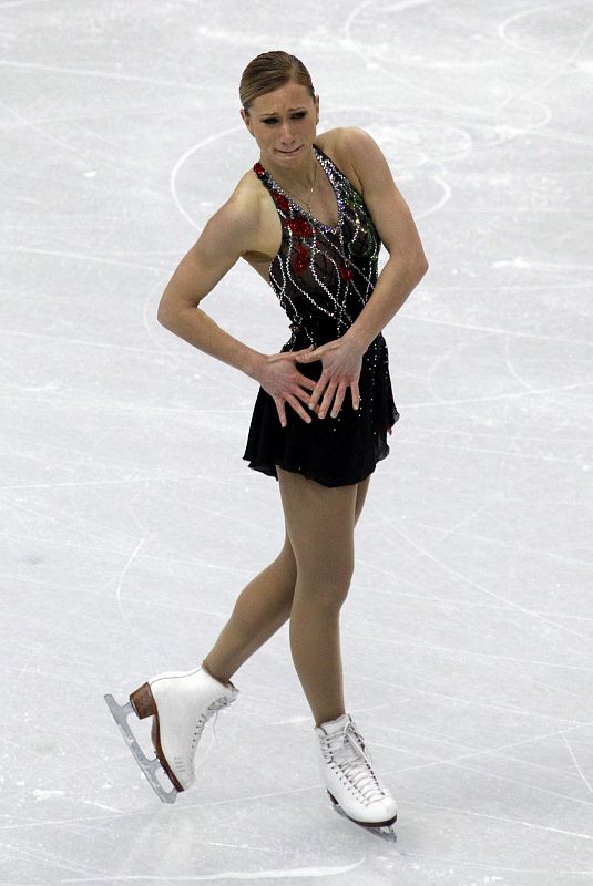 Canada's Rochette fights back tears after finishing her routine in women's short programme figure skating event at Vancouver 2010 Winter Olympics