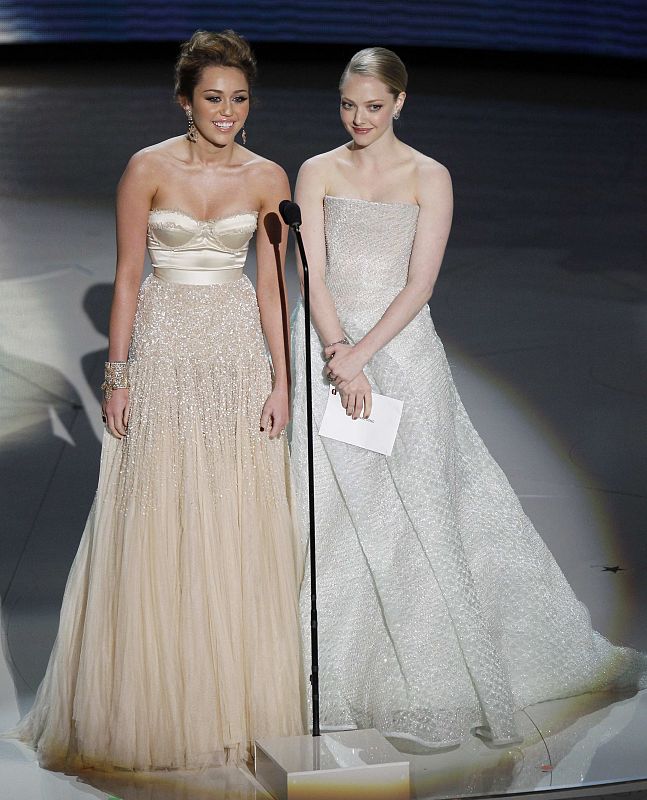 Miley Cyrus and Amanda Seyfried present an award during the 82nd Academy Awards in Hollywood