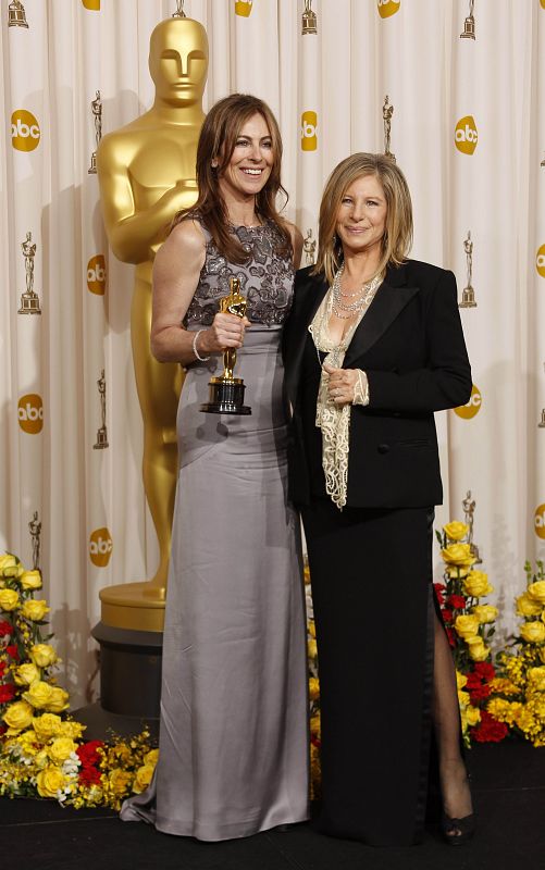 Director Bigelow poses with her Oscar for best director for "The Hurt Locker" with presenter Streisand at 82nd Academy Awards in Hollywood