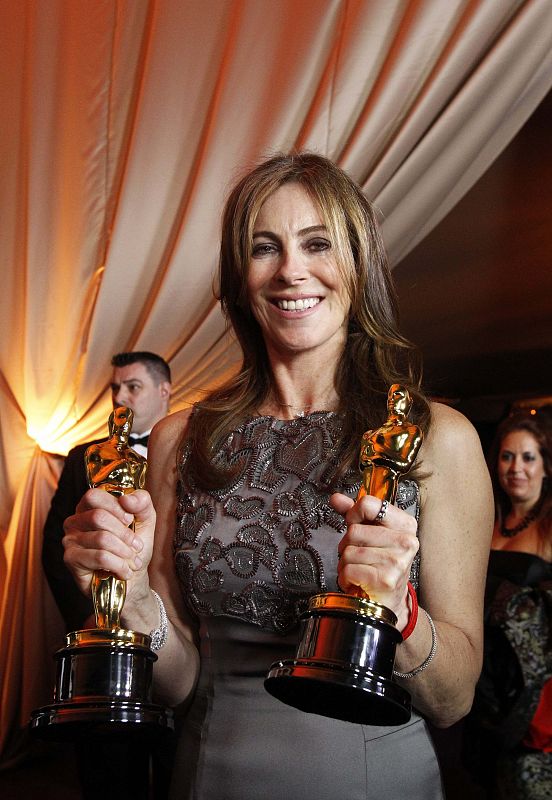 Director Kathryn Bigelow poses with her Oscars for best director and best film for "The Hurt Locker" at the 82nd Academy Awards in Hollywood