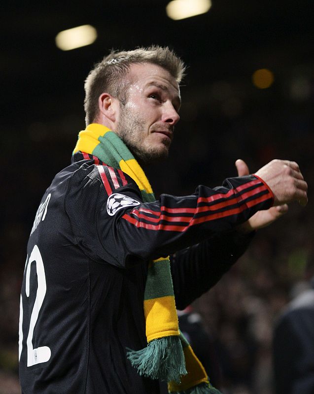 AC Milan's Beckham applauds the crowd after their Champions League match against Manchester United at Old Trafford in Manchester