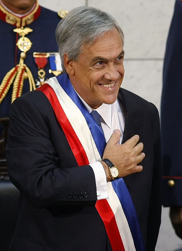 Chile's President Pinera gestures to the public after he was sworn-in at the Congress in Valparaiso