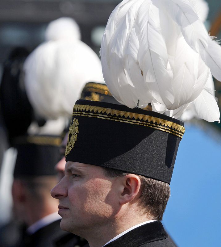 Polish miner is seen before start of commemoration ceremony for late Polish President Kaczynski and other plane crash victims at Pilsudski square in Warsaw